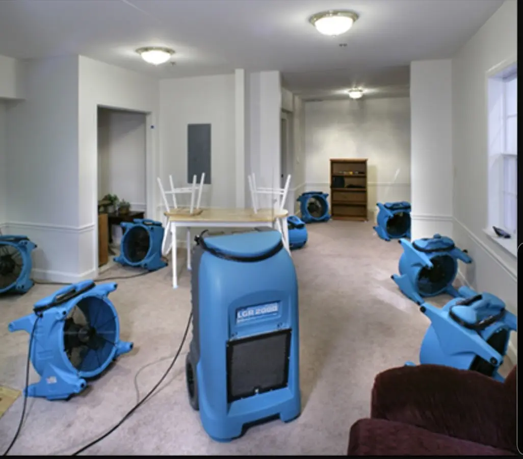 Air movers and dehumidifier setup for Water Damage Restoration in Dent